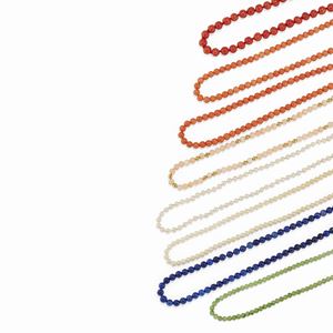 Eight 18K yellow gold, coral, laspilazuli, jade and cultivate and imitation pearl necklace