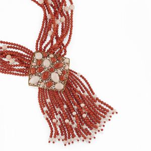 A 18K two-color gold, coral and diamond necklace
