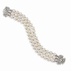 A 18K white gold, cultured pearl and diamond bracelet