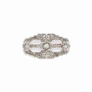 A 18K two color gold and diamond brooch
