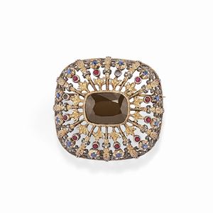 A 18K gold and silver, sapphire and ruby brooch