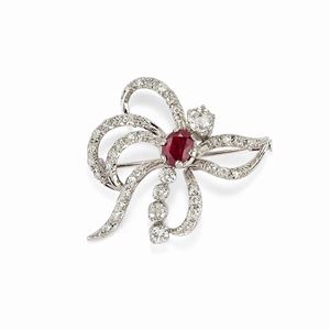 A 18K white gold, ruby and diamond brooch