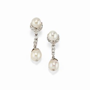 A 18K white gold, cultured pearl and diamond earclip