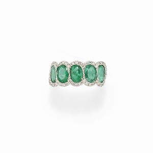 A 18K white gold, emerald and diamond ring