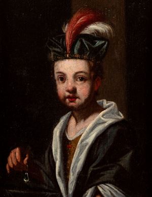Ragazzo in veste di principe con turbante e perla