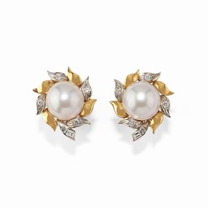 A 18K two color gold, diamonds and mabé pearl earrings
