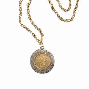 A 18K yellow gold caine and silver pendant with coin, signed Bulgari-Bulgari.