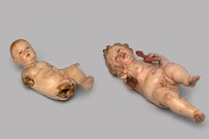 Lotto di due sculture da presepe in terracotta e legno raffiguranti Ges&#249; Bambino, Napoli secolo XIX