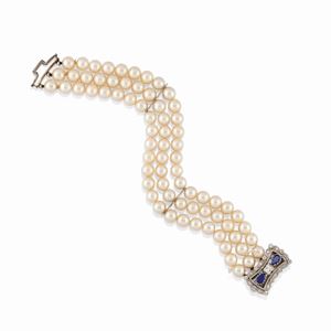 A 18K white gold, diamonds, sapphires and cultured pearls bracelet