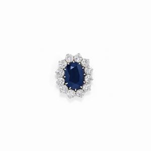 A 18K white gold, sapphire and diamonds pendant