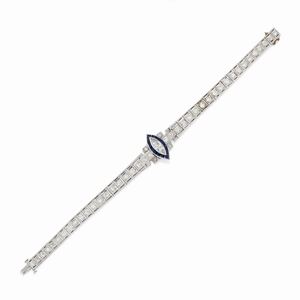  - A 18K white gold, diamond and sapphire bracelet