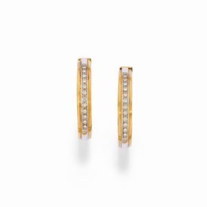 A 18K two color gold and diamond earrings, with warranty