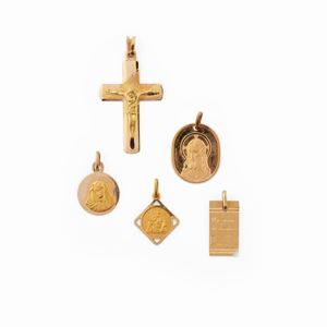 Five 18K yellow gold pendants