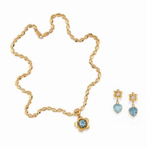 A 18K yellow gold, topaz and synthetic gemstone demi parure