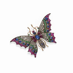 A 18K yellow gold, silver, sapphire, ruby and diamond brooch, circa 1950