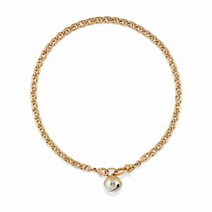 A 18K yellow gold watchchain and pendant signed Pomellato