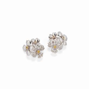 A 18K white gold, diamond and yellow sapphire earrings