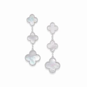  - A 18K white gold and mother of pearl pendant earrings