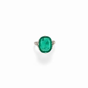 A platinum, diamond and emerald ring, early 20th Century