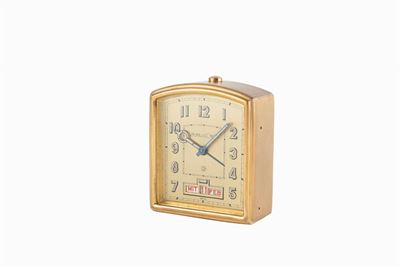 Orologio da tavolo con svegliarino e calendario, anni '50, ottone dorato