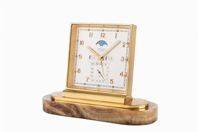 Orologio da tavolo con svegliarino, calendario e fasi lunari, anni '60