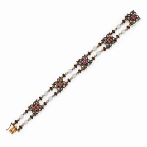 A 18K yellow gold and silver, diamond, ruby and cultured pearl bracelet