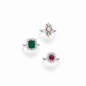 Three 18K white gold, diamonds, ruby and doublet of emerald rings