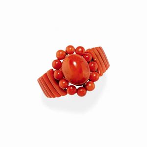 A 18K yellow gold and coral bangle, end 19th Century