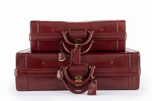 Lot of two burgundy leather suitcases