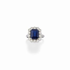  - A platinum, diamond and sapphire ring