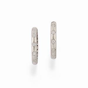  - A 18K white gold and diamond earrings