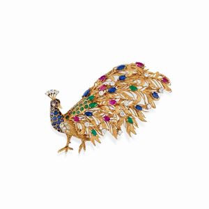 A 18K yellow gold with diamond, ruby, sapphires, emerald and colored gemstones brooch, 1960-70
