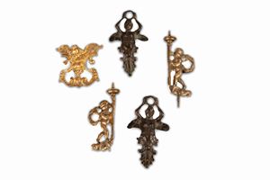 Lot of five old bronze items: three handles and two candle holders