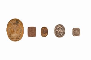 Lot consisting of five seals in bronze and iron, two of which in silver, without handles, with noble coats of arms, 18th - 19th centuries