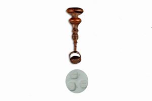 Iron seal with wooden handle, reel-shaped terminal part with three different noble coats of arms, 18th century