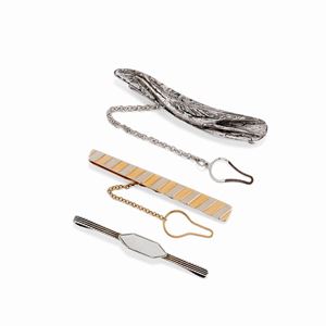 A 18K two-color gold and silver lot of three tie clips