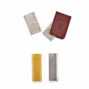 A plated silver, plated gold and steal lot of two lighters and two sigar cutters