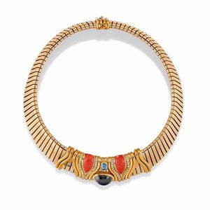 A 18K two color gold, onyx, aquamarine and diamonds necklace