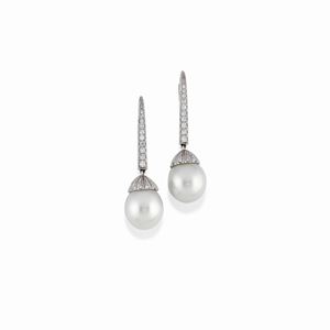  - A 18K white gold, cultured pearl and diamond earrings