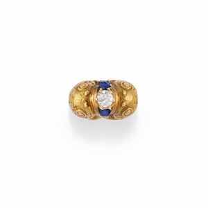 A 18K yellow gold, diamond and sapphire ring