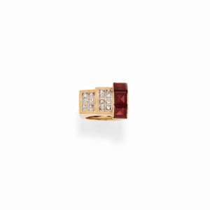 A 18K red gold, diamond and garnet ring