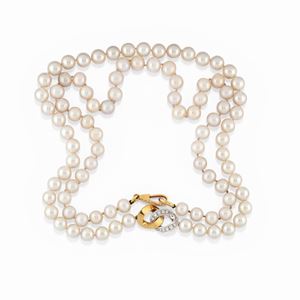A 18K two color gold, cultured pearl and diamond lot of two neacklaces, Pomellato