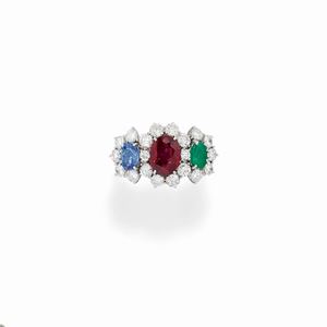  - A 18K white gold, ruby, emerald, sapphire and diamond ring