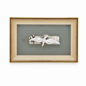 A silver low relief "seagull"