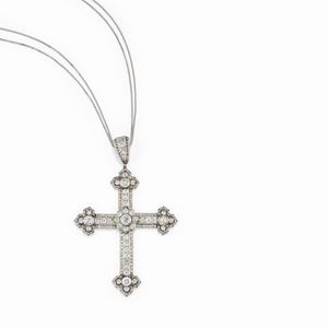 A platinum and diamond pendant, early 20th Century with a modern silver chain