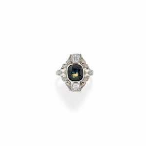 A 18K white gold, diamond and synthetic green gemstone ring