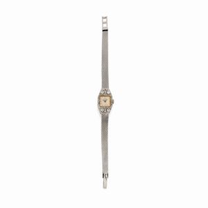 A 18K white gold, platinum and diamond lady's wristwatch, defect