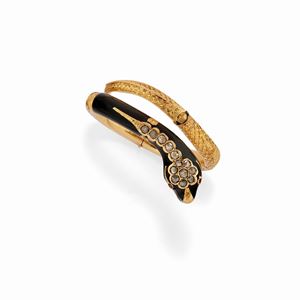 A 18K yellow gold, ruby, diamond and black enamel bracelet, defect