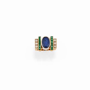A 18K two-color gold, sapphire, emerald and diamond ring
