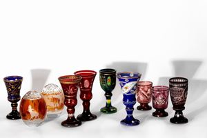  - Lot consisting of eight glasses and two eggs in painted Bohemian crystal